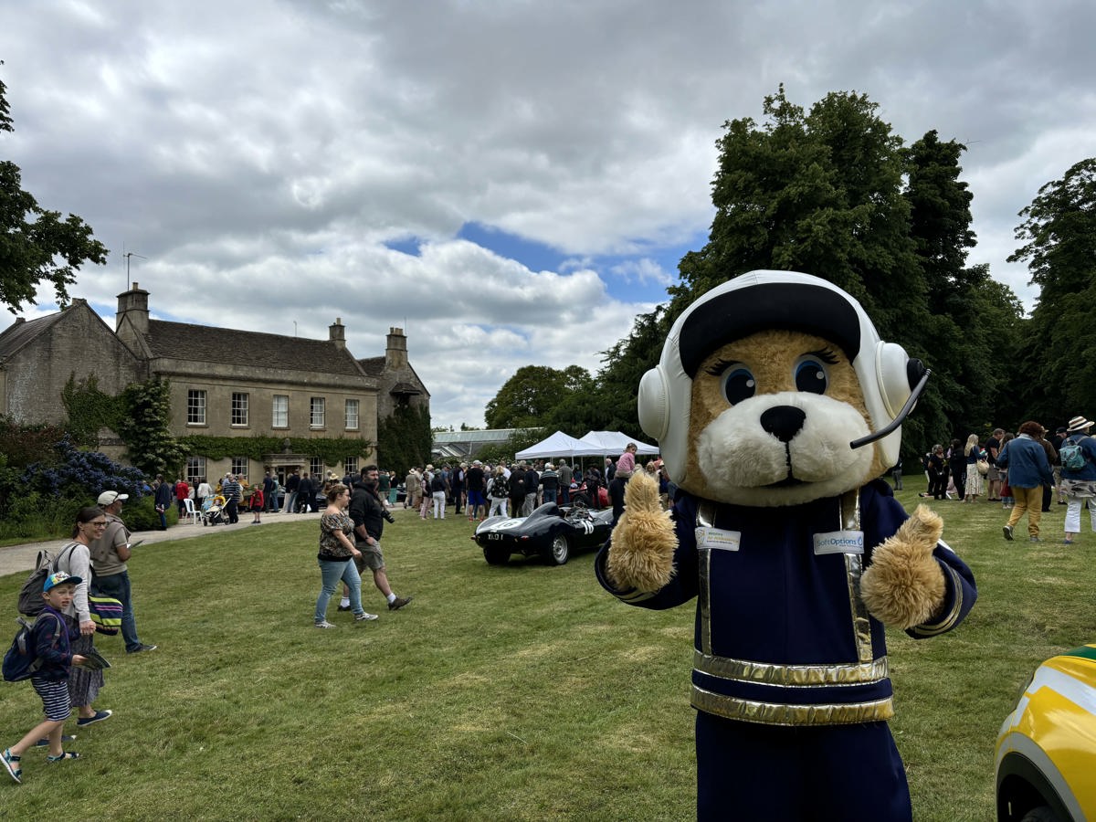 A mascot with their thumbs up in front of Middlewick House