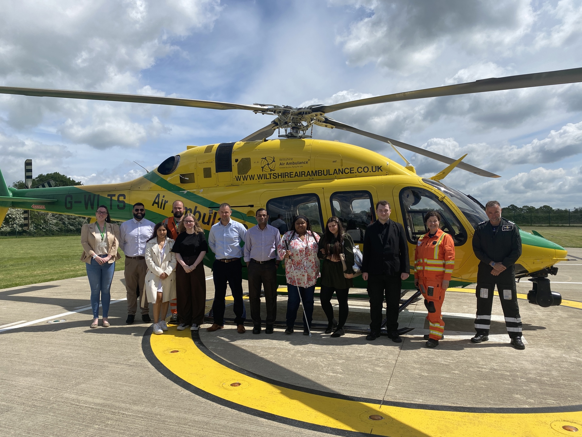 Staff from Halo Staffing in front of the WAA helicopter Staff from Halo Staffing in front of the WAA helicopter