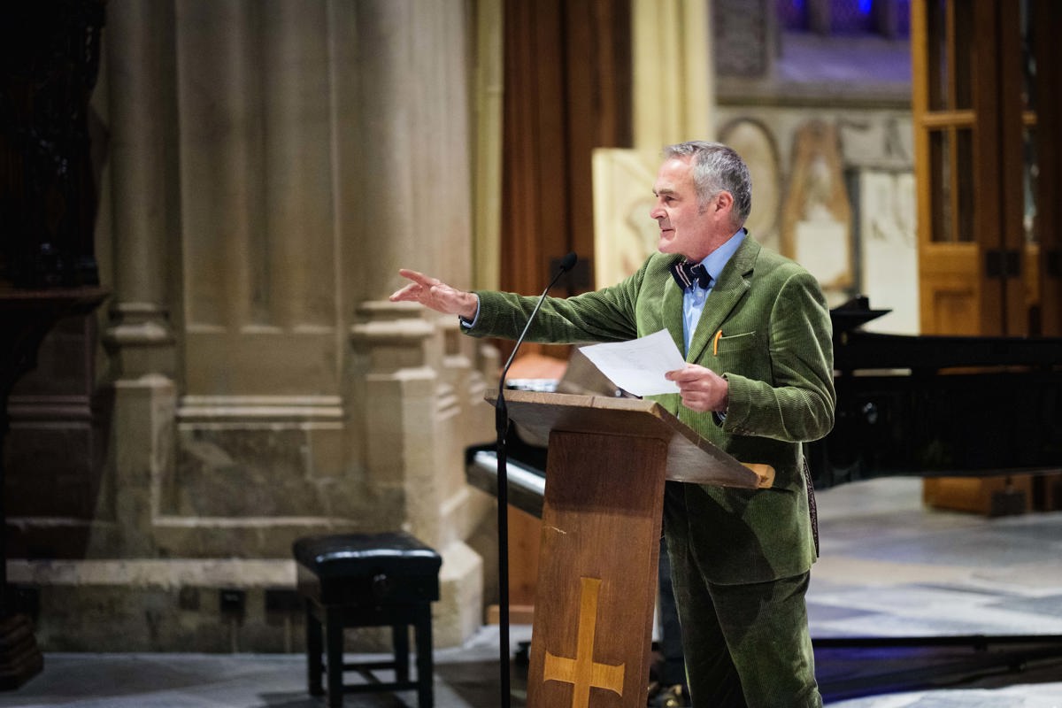 TV's Paul Martin speaking to a crowd from a pulpit